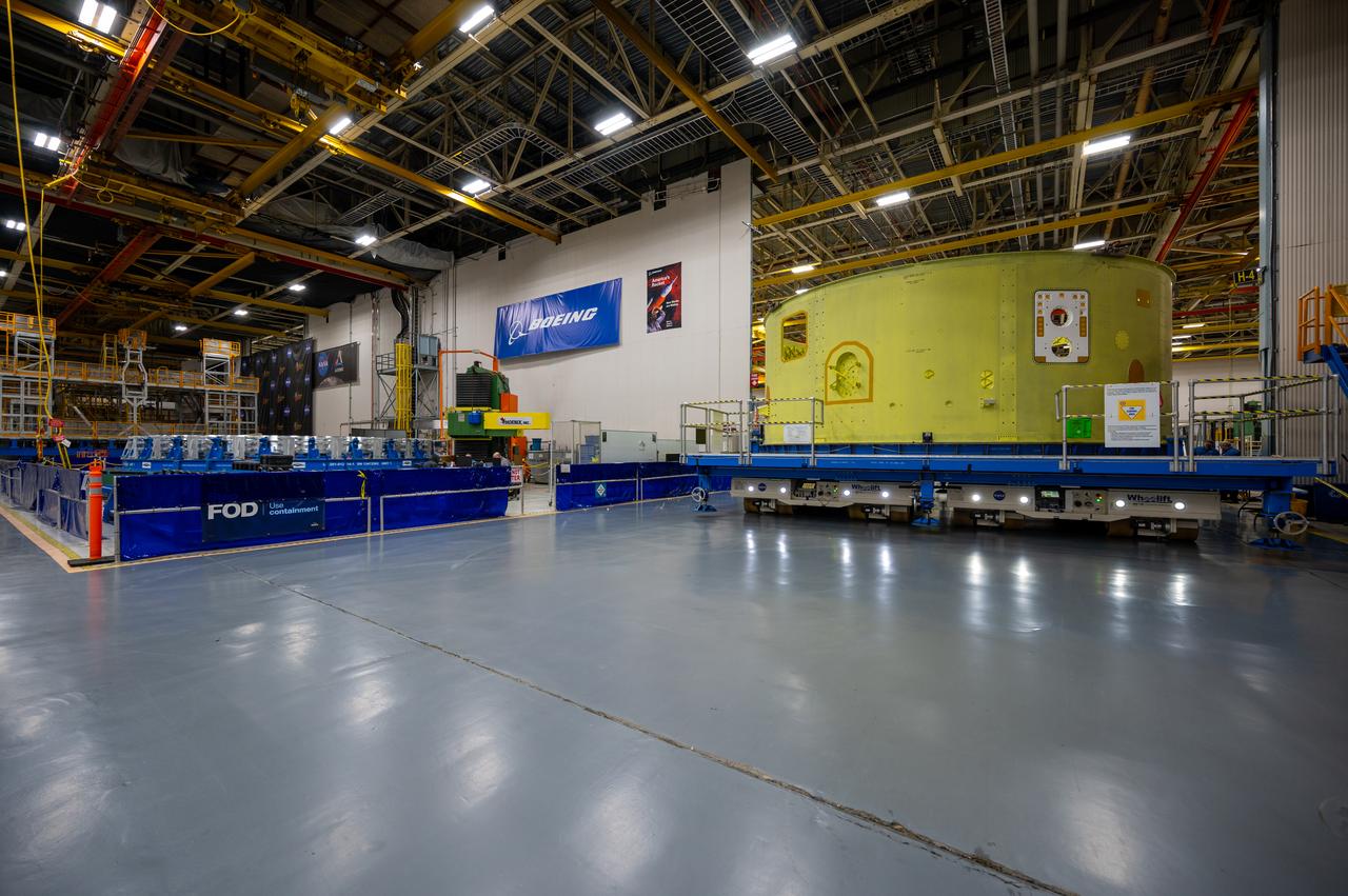 Crews at NASA’s Michoud Assembly Facility in New Orleans move the forward skirt of NASA’s Space Launch System (SLS) rocket to another part of the facility Dec. 15. Teams are preparing to apply the thermal protection system to the flight hardware, which will protect it from the extreme temperatures during launch and flight. The forward skirt is part of the core stage that will power the SLS rocket for the Artemis III mission. The forward skirt houses flight computers, cameras, and avionics.. The SLS core stage is made up of five unique elements: the forward skirt, liquid oxygen tank, intertank, liquid hydrogen tank, and the engine section. When fully stacked, the forward skirt is located at the top of the core stage and connects the stage to the upper part of the rocket. Together with its four RS-25 engines, the rocket’s massive 212-foot-tall core stage — the largest stage NASA has ever built — and its twin solid rocket boosters produce 8.8 million pounds of thrust to send NASA’s Orion spacecraft, astronauts and supplies beyond Earth’s orbit to the Moon and, ultimately, Mars. Offering more payload mass, volume capability and energy to speed missions through space, the SLS rocket, along with NASA’s Gateway in lunar orbit, the Human Landing System, and Orion spacecraft, is part of NASA’s backbone for deep space exploration and the Artemis lunar program. No other rocket is capable of carrying astronauts in Orion around the Moon in a single mission.